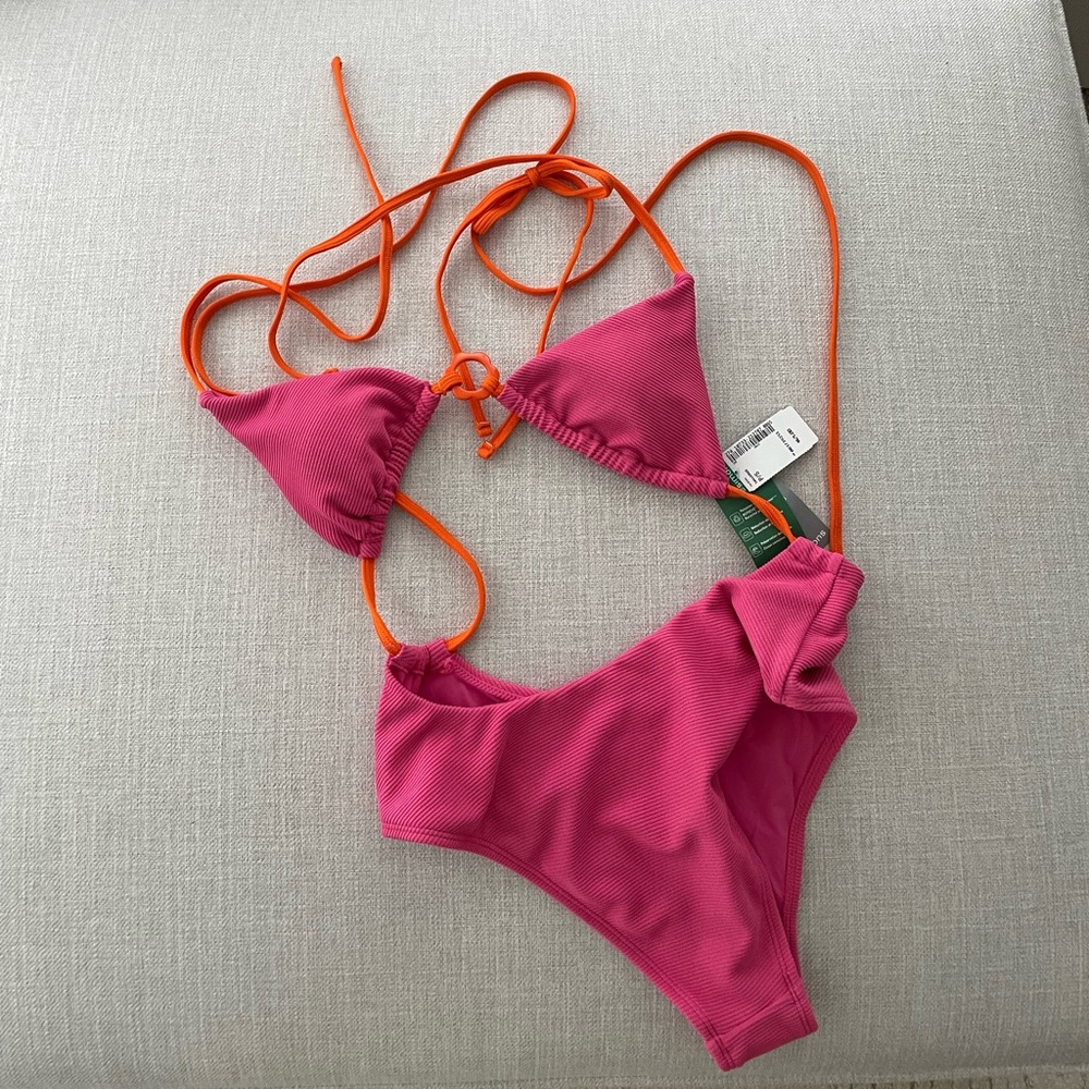 Pink monokini with orange enamel flower